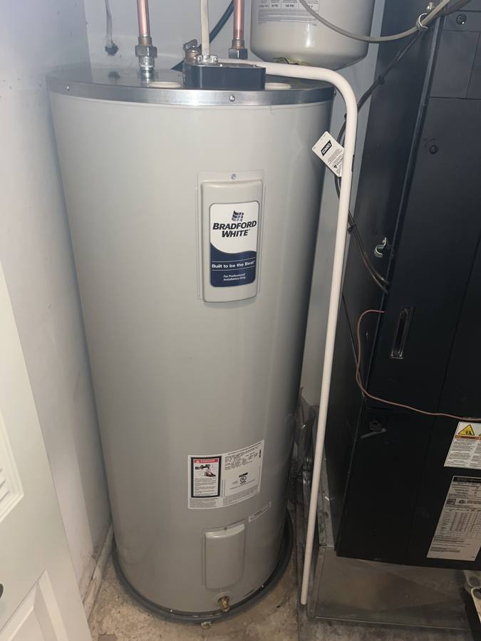 New Bradford White electric water heater in the same closet, next to the air handler